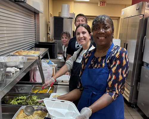 Hope Center volunteers preparing and serving meals